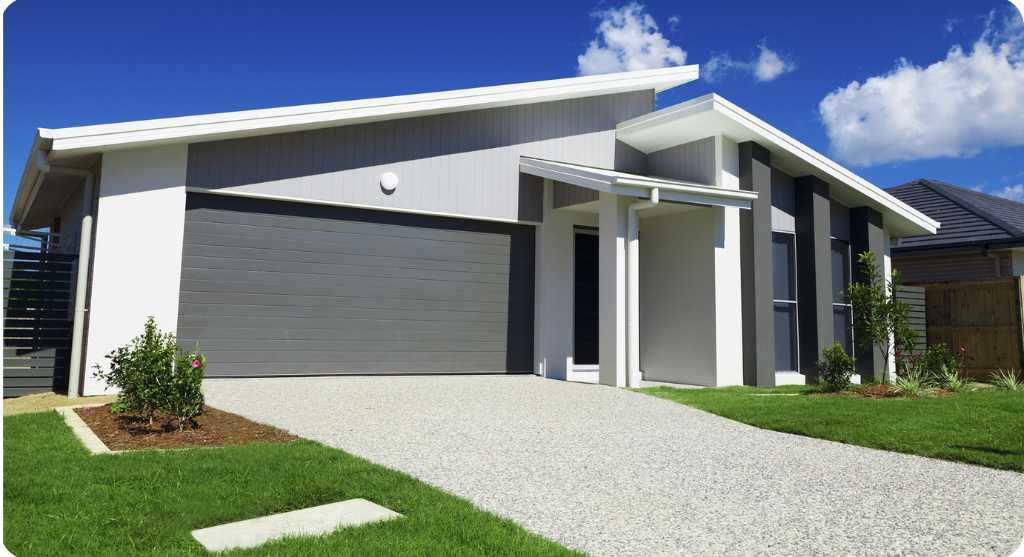 Stylish exposed modern concrete driveway for a modern home in Melbourne, enhancing curb appeal and durability.